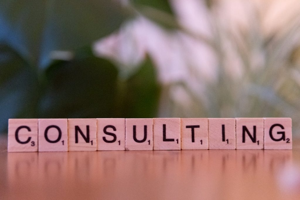 a-wooden-block-spelling-consulting-on-a-table-ocetxj93mww