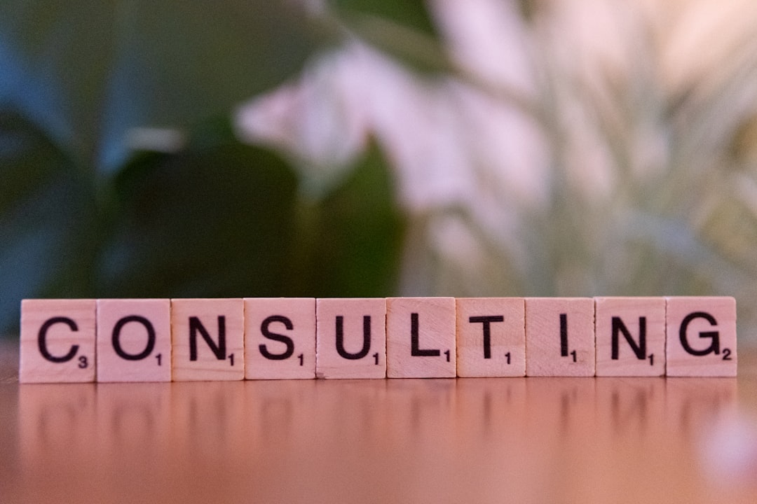 who-are-we-02 a-wooden-block-spelling-consulting-on-a-table-ocetxj93mww