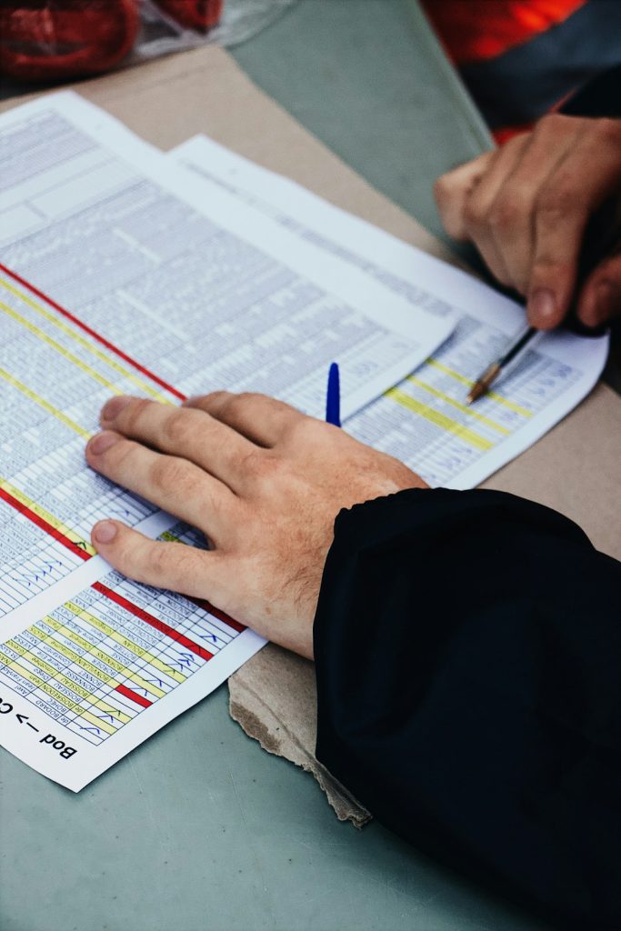 persons-hand-on-two-stack-of-paper-a7bbjzmdqk4 persons-hand-on-two-stack-of-paper-a7bbjzmdqk4